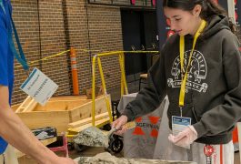 Two people working on a construction project at a convention center.