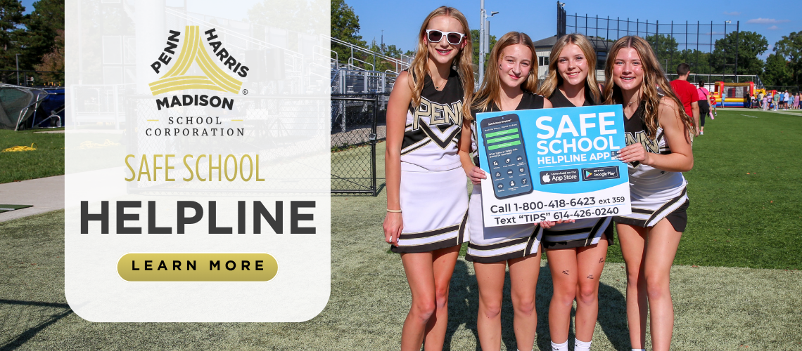 Three cheerleaders posing with a sign for Safe School Helpline.