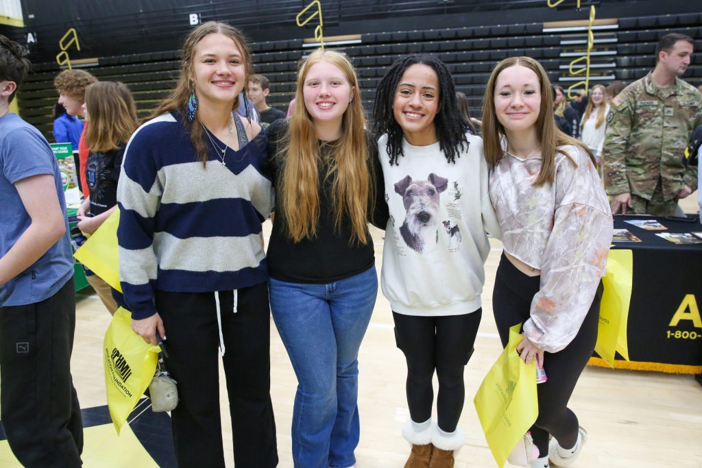 Penn High School students standing arm in arm at a job fair