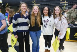 Penn High School students standing arm in arm at a job fair