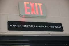 Sign on wall says "Schafer Robotics and Manufacturing Lab".